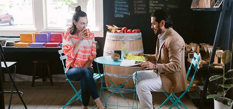 a couple sitting a table while dining out